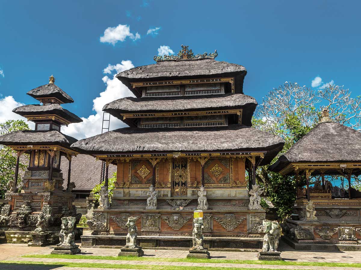 Temple courtyard with carved stone gates, Bali